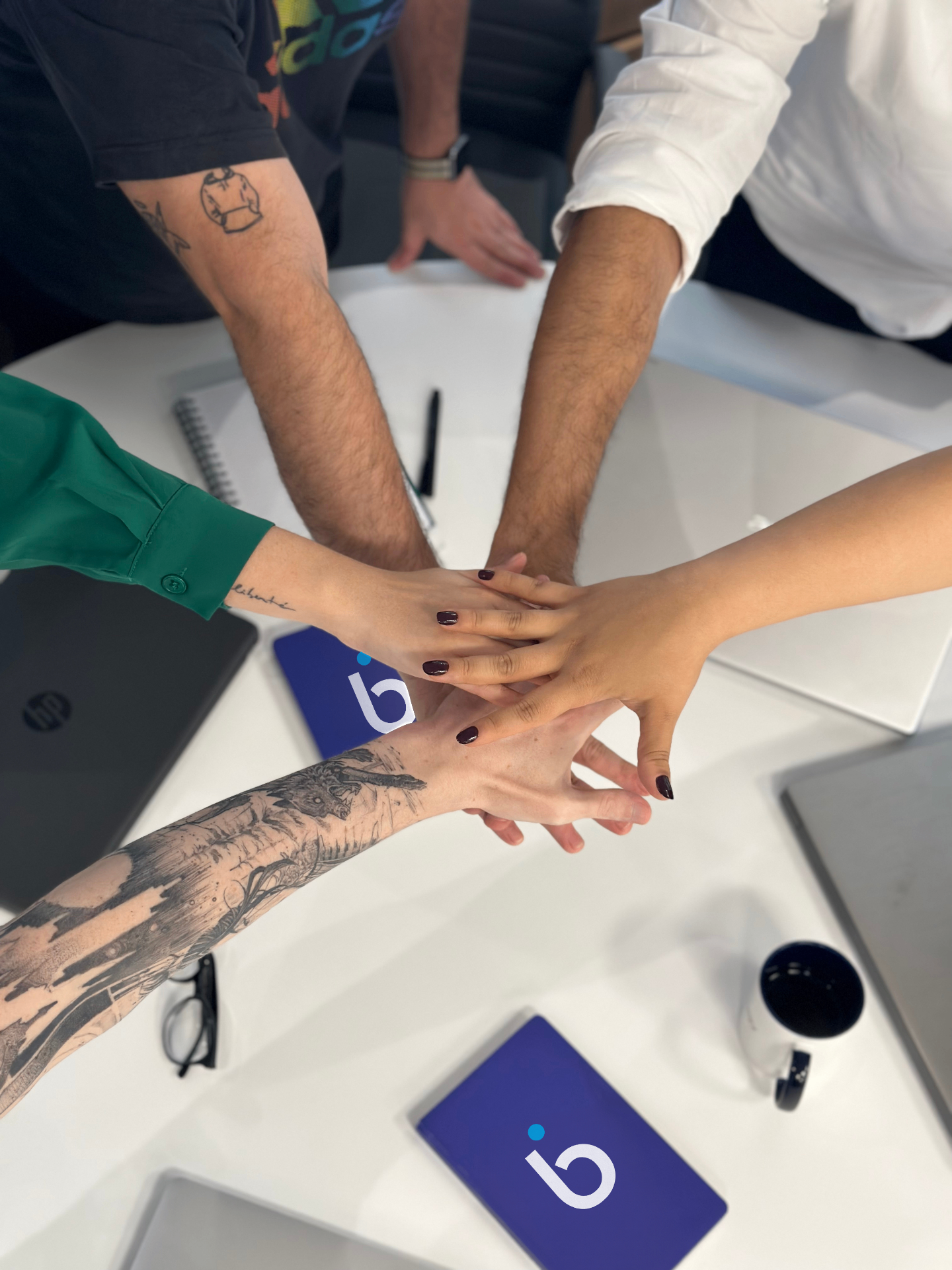 Luby team hands together